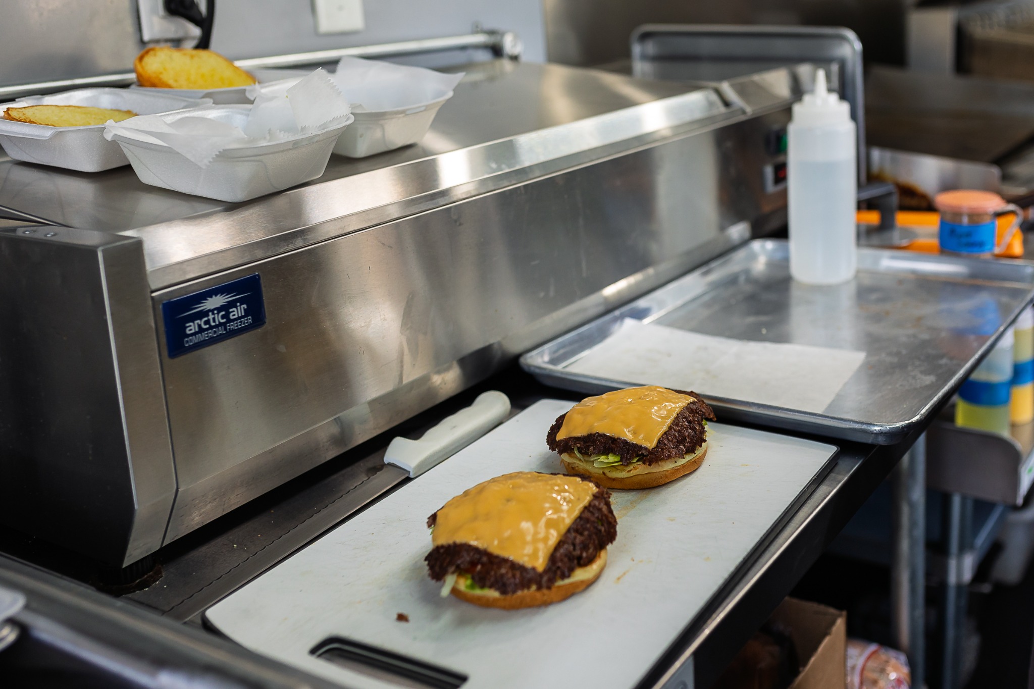 Smash burgers being prepared